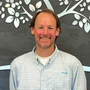 Headshot of Sam Champion